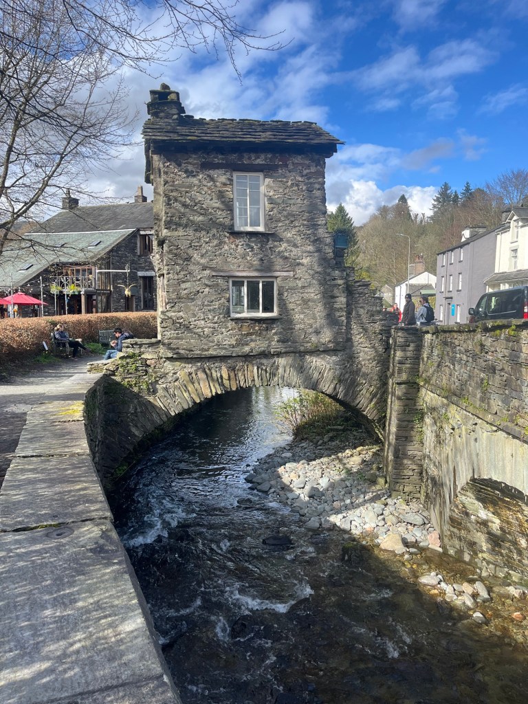 Bridge with stone cottage on it